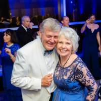 President Tom and Marcia Haas posing in the Laker Lounge